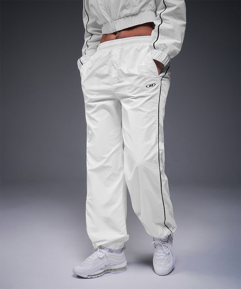 【韓国限定】W PIPING LINE WIND SHELL PANTS [WHITE]