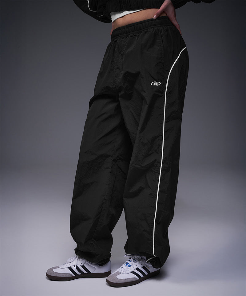 【韓国限定】W PIPING LINE WIND SHELL PANTS [BLACK]