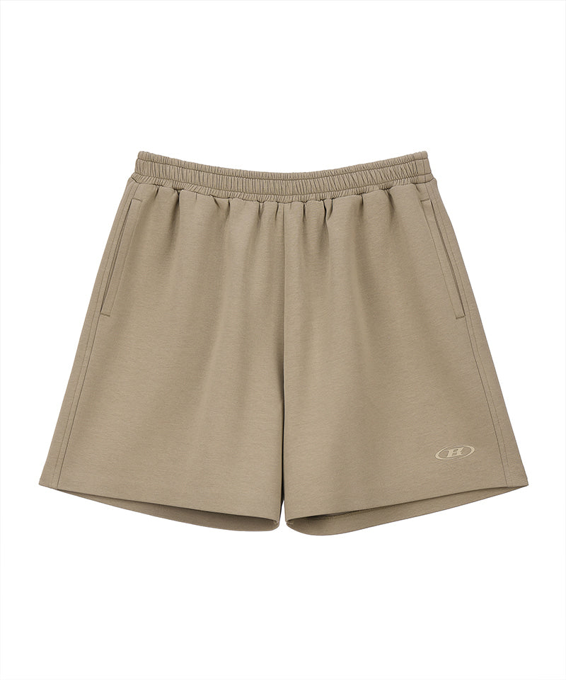 【予約販売：ご注文より1～3週間後に発送予定】SYMBOL B TECH SHORTS [BEIGE]